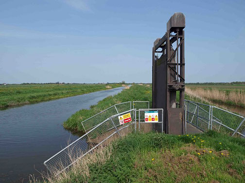 slideshow Picture of canal with flood control system.
